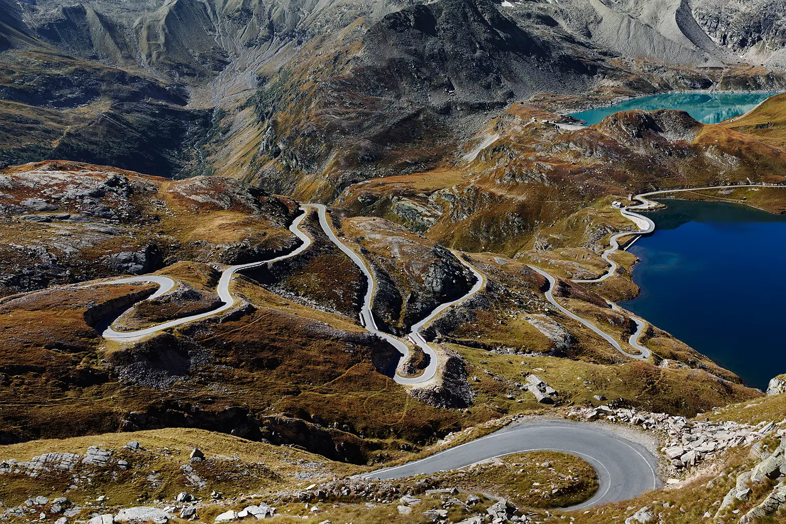 The Nivolet Pass road, with its southern approach, hairpin bends and reservoirs, in the Gran Paradiso Alpine National Park