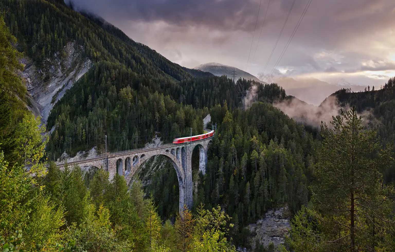 Train crosses the Rhaetian Railway's Wiesener Viaduct